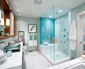 An image depicting a custom glass shower enclosure with frameless glass shower doors from Monsey Glass